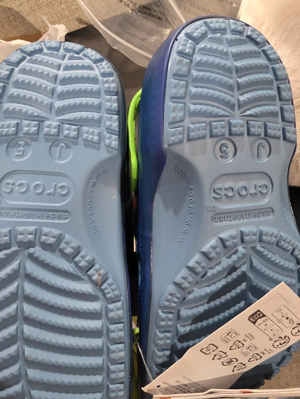 CROCS Kids Blue Clog Sandals with Neon Green Straps and Decorative Charms